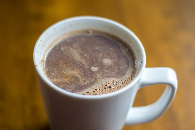 Mexican hot chocolate coffee in a white mug.