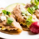 These breakfast enfrijoladas are so easy to make. They're corn tortillas covered in a delicious bean sauce and filled with scrambled eggs. Enjoy this yummy Mexican breakfast!