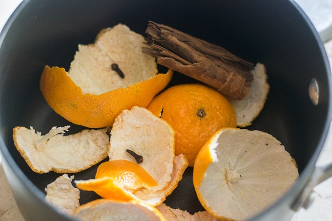 orange peels, cinnamon and cloves in a pot