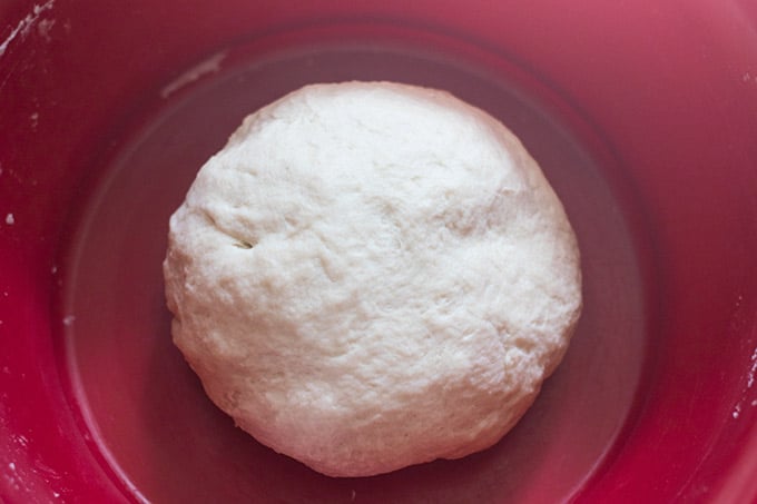 flour tortilla dough in a red bowl