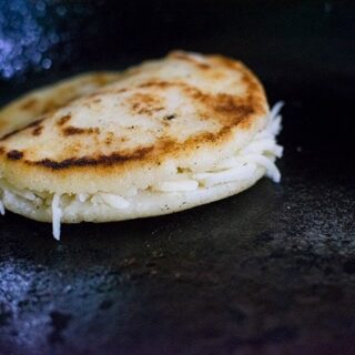 arepa on cast iron skillet