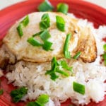 fried egg over rice garnished with chopped green onions