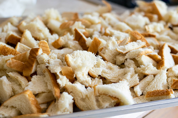 White sandwich bread torn into pieces.