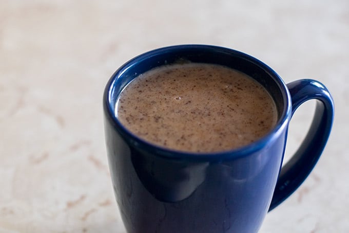 chocolate atole in a blue mug