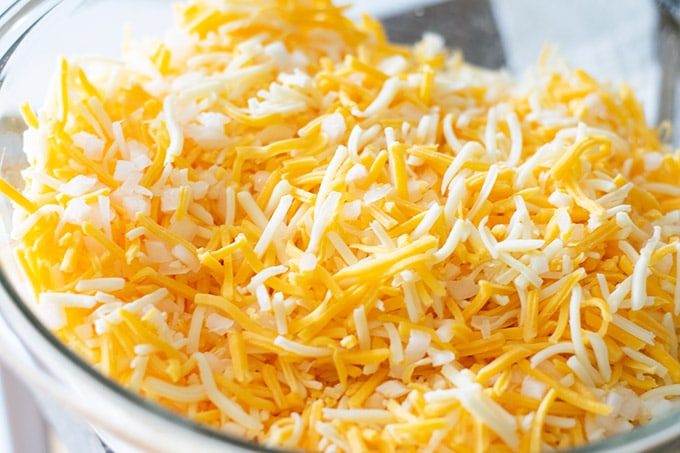 shredded mexican cheese and diced onion in a bowl