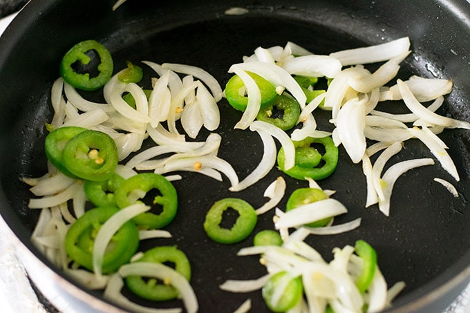 onion and jalapeno in a skillet