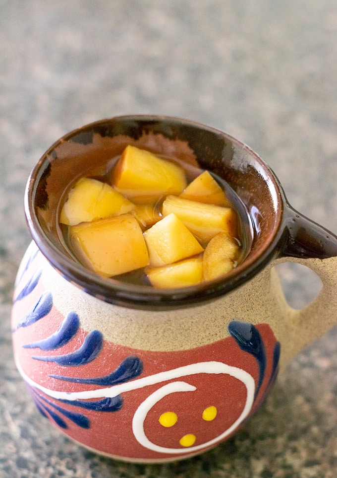 ponche navideño in a Mexican mug.