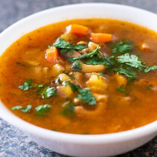 picadillo soup in a white bowl