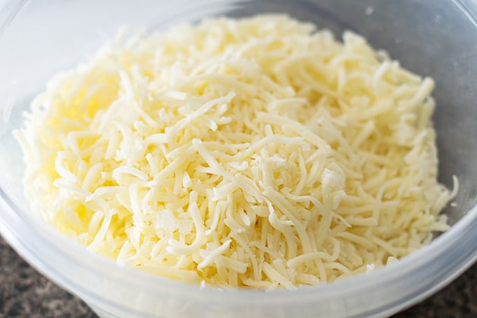 shredded mozzarella cheese and diced onion in a bowl