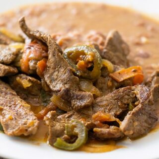 bistec a la mexicana on a white plate