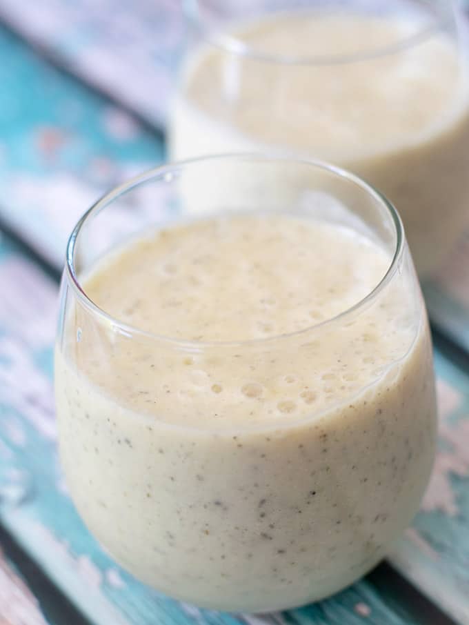 mango and coconut milk smoothie recipe in two glasses