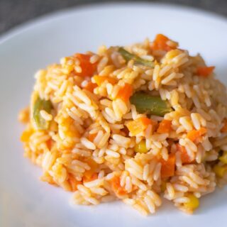 Mexican red rice with veggies on a plate