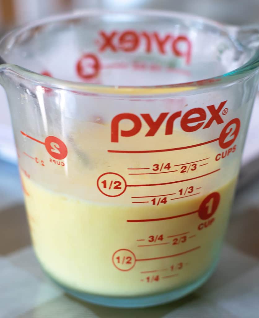 corn starch and milk in a measuring cup