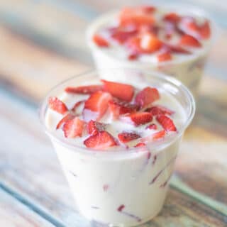 Mexican strawberries and cream in two cups.