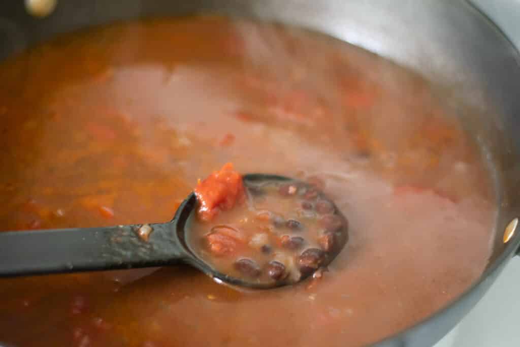 Black bean soup in a skillet.