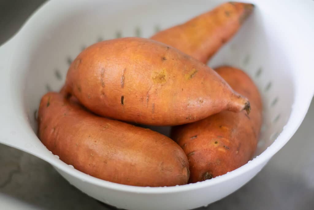 Sweet potatoes in a colander.