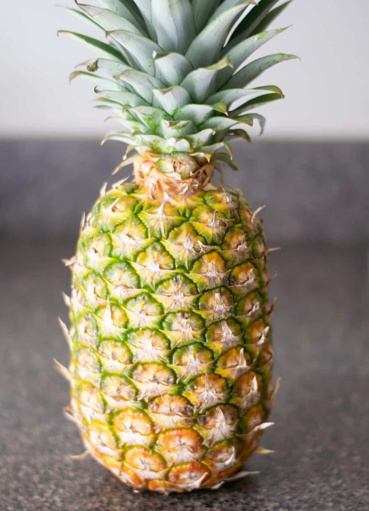 A pineapple on a countertop.