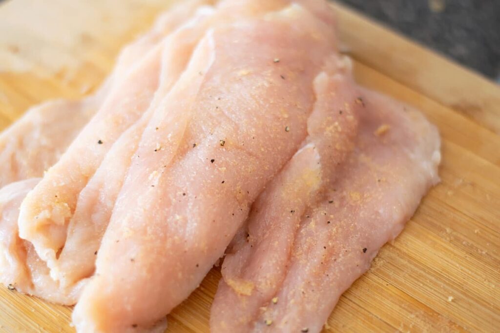 Pounded and seasoned chicken breasts.