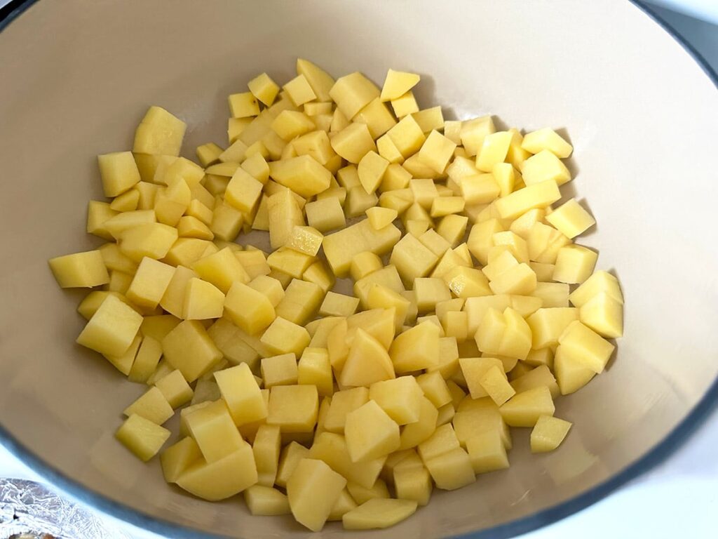 Diced gold potatoes in a dutch oven.