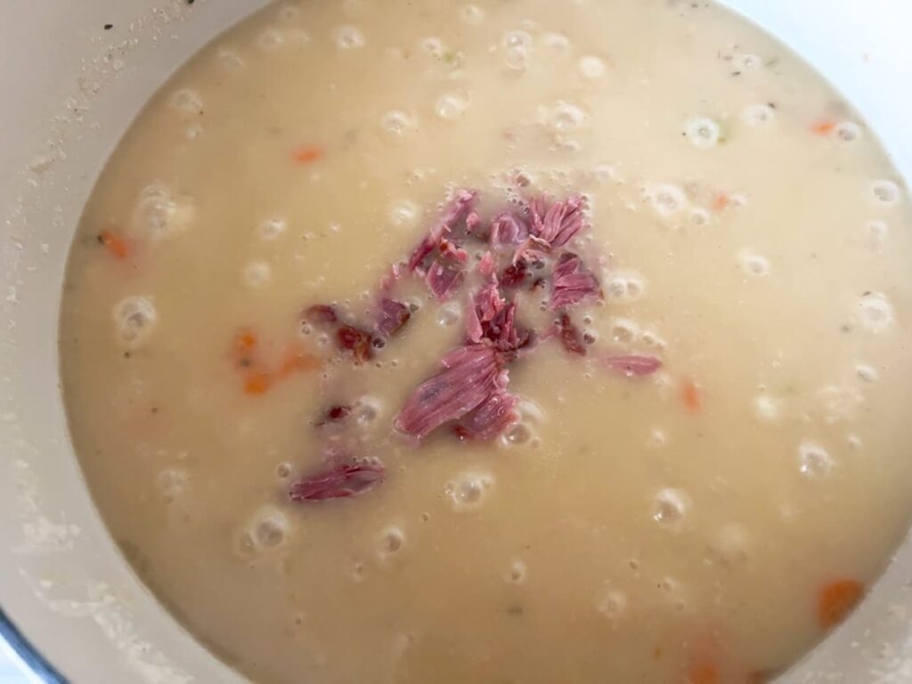 Ham hock stew in a dutch oven.