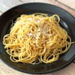 Easy asian noodles recipe on a black plate.