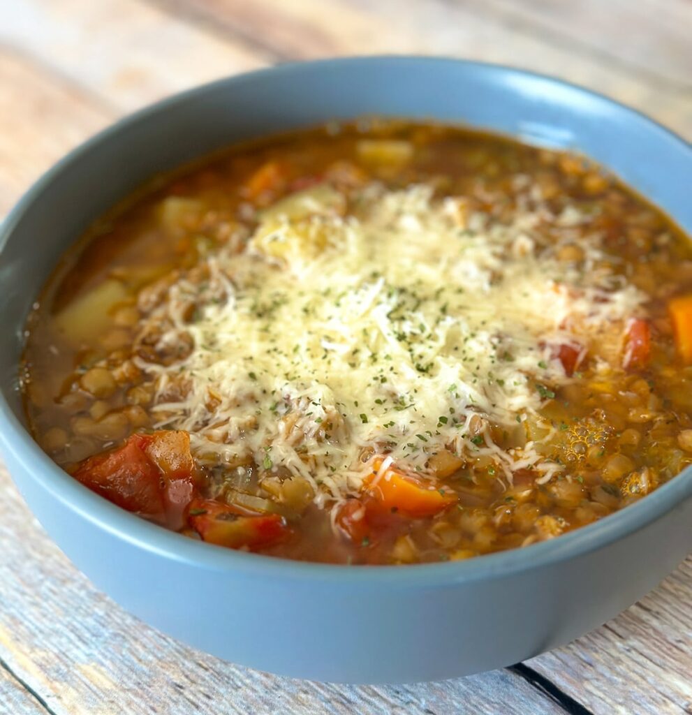 A bowl of lentil potato soup.