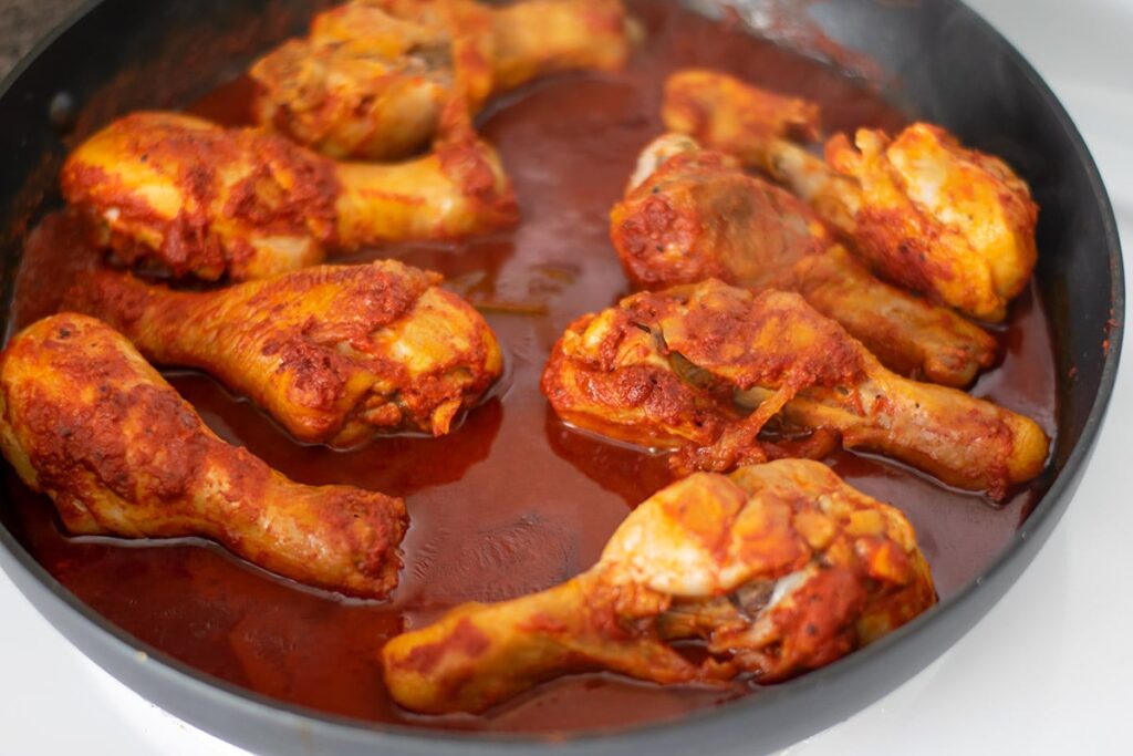 Chicken in a red sauce.