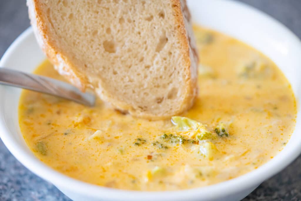 Broccoli and cheedar soup with a slice of dutch oven bread.