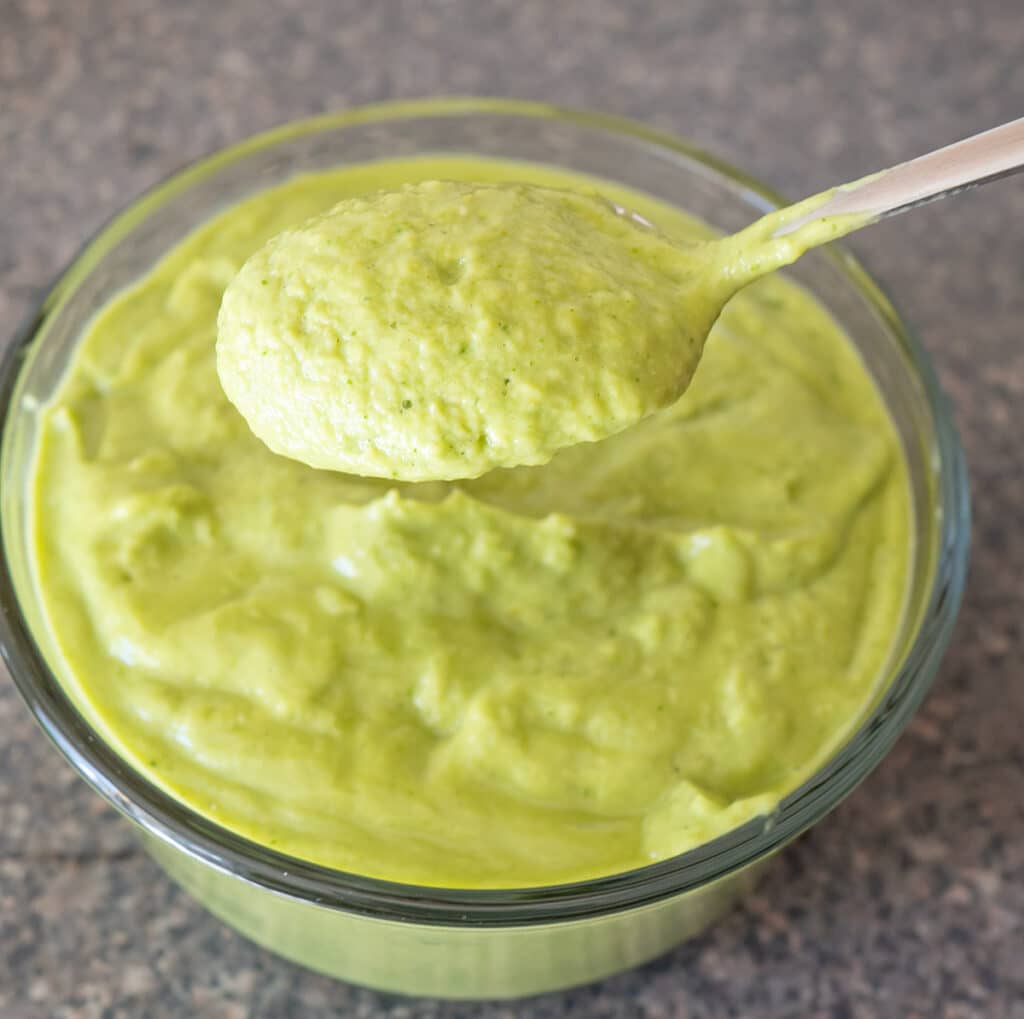 Creamy tomatillo salsa in a bowl.
