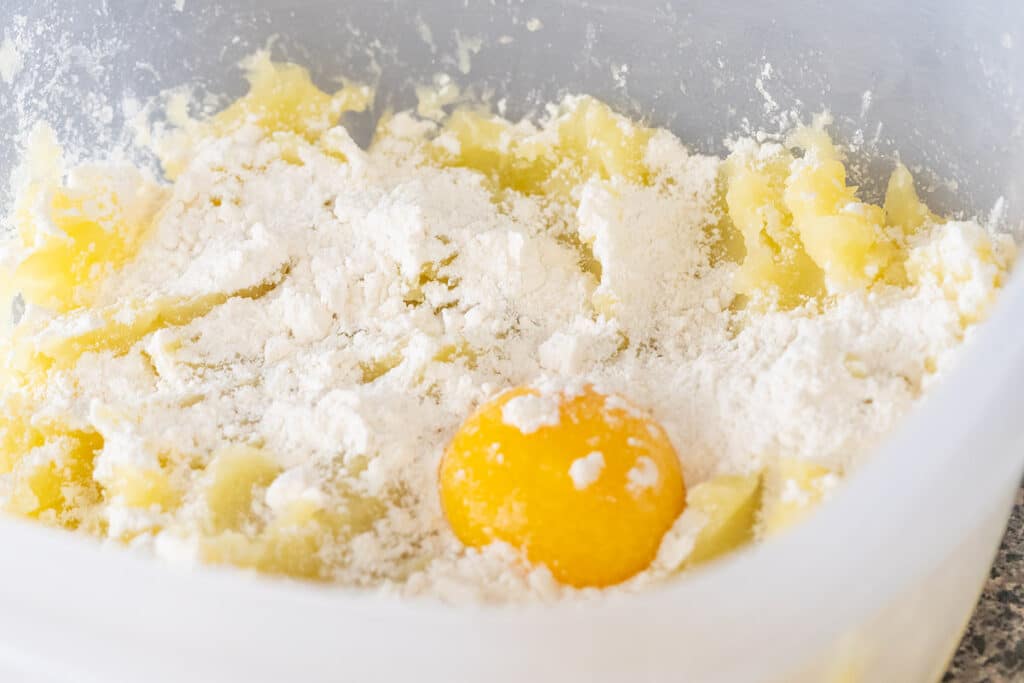 Making gnocchi dough in a bowl.