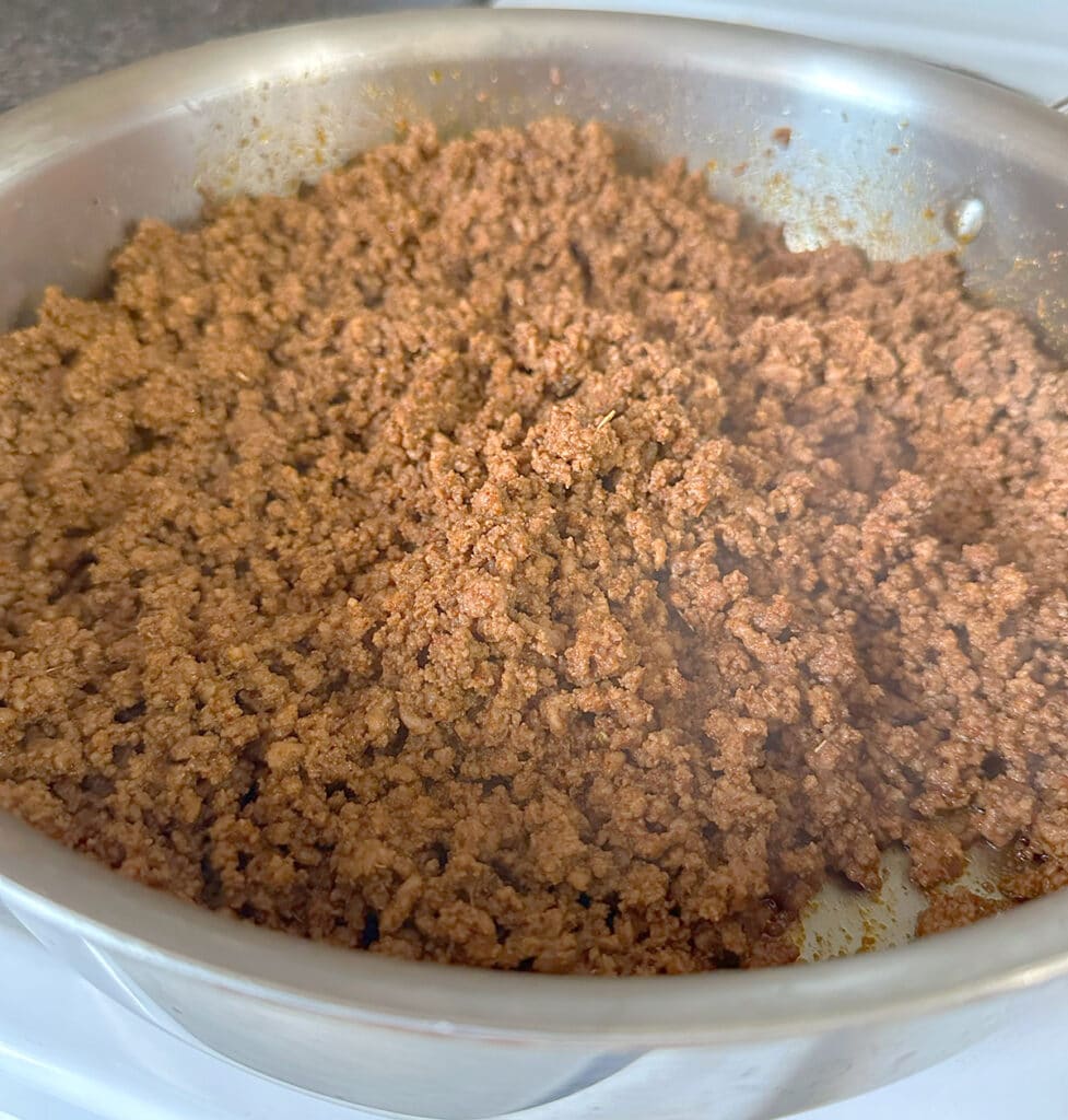 Browned ground beef for Dorito taco salad.