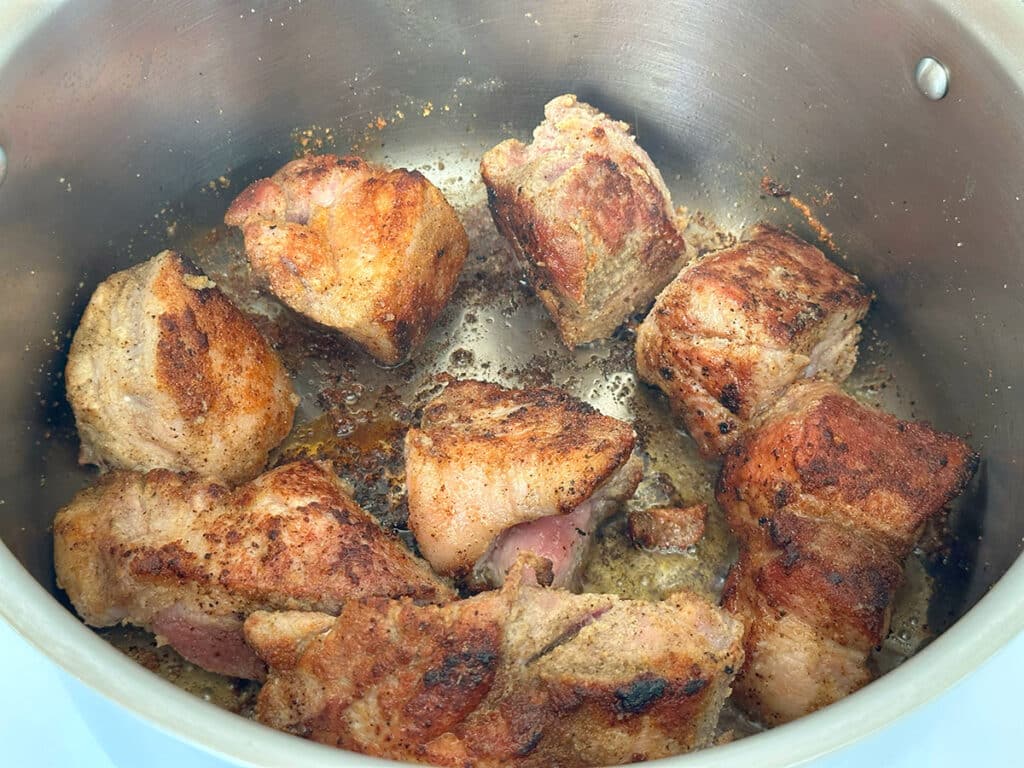 Seared pork meat in a pot.