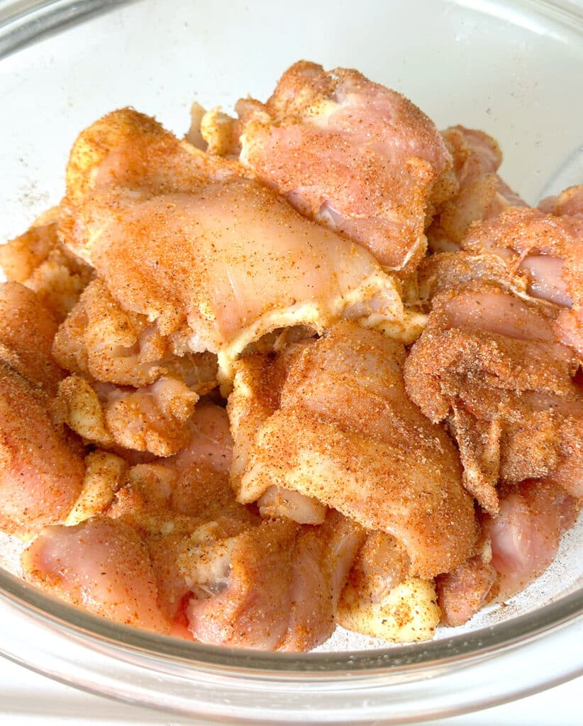 Seasoned chicken in a bowl.