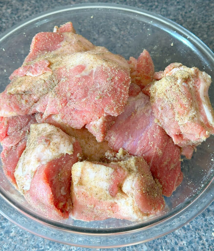 Seasoned pork meat in a bowl.